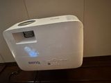 a white air purifier sitting on top of a wooden floor