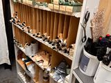 a shelf full of tools and supplies in a room