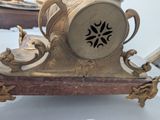 a clock that is sitting on a table in a room