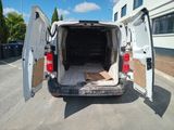 a white van with its doors open in a parking lot
