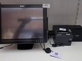 a computer monitor sitting on a desk next to a printer