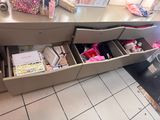 a lot of items in the drawers of the counter