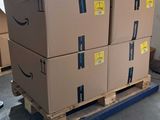boxes on a pallet are stacked on top of each other in a warehouse