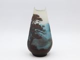 a vase that has a picture of a tree on it
