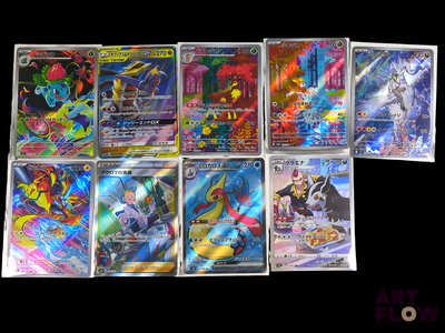 a lot of different types of pokemon cards on the table