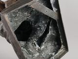 an image of a piece of metal with a broken window