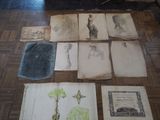 many old books on the floor with drawings on them