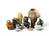 many different vases that are sitting on a white surface