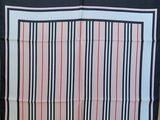 an image of a black and white scarf with red stripes