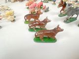 many figurines of animals that are on the table