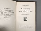 an open book with a picture of a man in a suit and tie on it