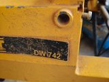 a close up of a machine that is sitting on the ground