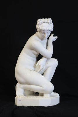 an image of a statue of a woman sitting on a black background