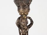 an image of a statue of a boy holding a crown on his head