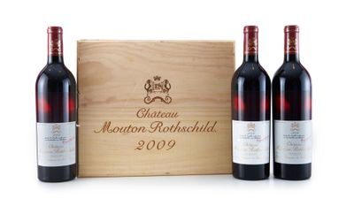 three bottles of wine in front of a wooden box