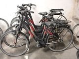 many bikes that are parked next to each other in a room