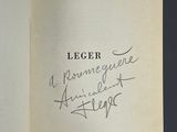 an open book with a handwritten title on the cover