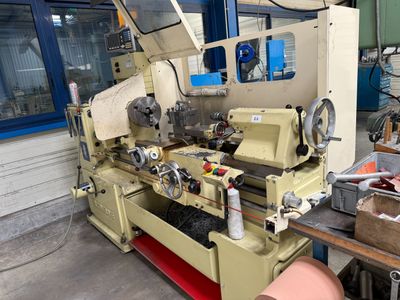 a machine that is working on a piece of wood