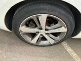 a close up of a tire on the side of a car