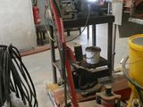 a picture of a machine that is sitting on a pallet in a garage