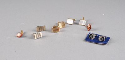 five pairs of earrings that are sitting on a table