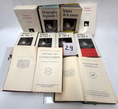 several books are stacked on top of each other on a table