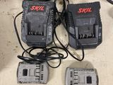 several power tools are sitting on a table next to some wires