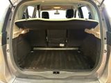 the back of a car with the trunk open and the seats folded down