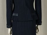 an image of a woman ' s suit on a mannequin stand