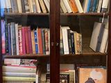a book case with many books on top of it