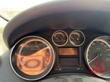 a close up of a car dashboard with various gauges