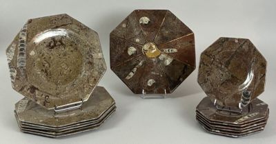 four pieces of silver metal with a clock on each of them