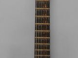 an image of a guitar sitting on top of a wooden stand