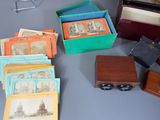 a lot of old photos in a box on the table