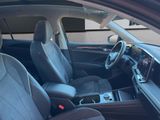 the interior of a car with a dashboard and a steering wheel