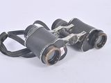 a pair of binoculars that are sitting on the ground