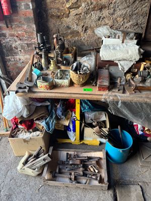 a workbench that has many tools on it