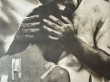 an old poster of a man holding a gun in his hands