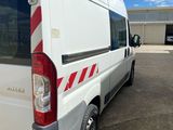 a white van that is parked in a parking lot