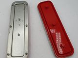 two red and silver metal items on a white surface