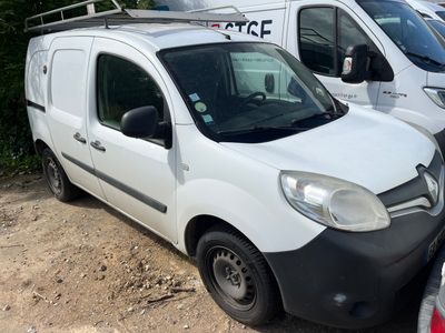 a white van that is parked next to other cars