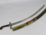 two swords are displayed on a white surface, one has a wooden handle and the other has a brass handle