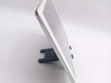 a white tablet computer sitting on top of a table