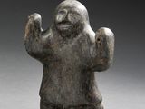 an image of a statue of a man with his hands in the air