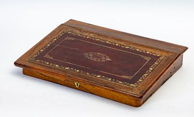 a small wooden box with a leather cover on it