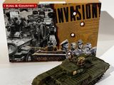 toy army tank in front of a boxed box with a picture of soldiers