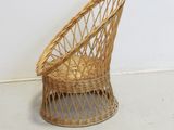 a wicker chair that is sitting on the floor