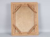 an old picture frame with a wooden frame on a grey background