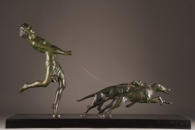 bronze statue of a man running with a dog on a leash