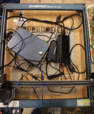 a box with a lot of wires and a laptop in it